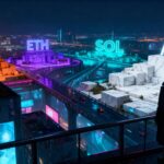 A person in a dark coat stands on a balcony at night overlooking a neon‑lit futuristic city, with giant glowing crypto tickers BTC, ETH, SOL, and AAVE mounted on marble platforms above elevated highways.
