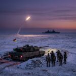 Tank and missile launch at snowy coastline
